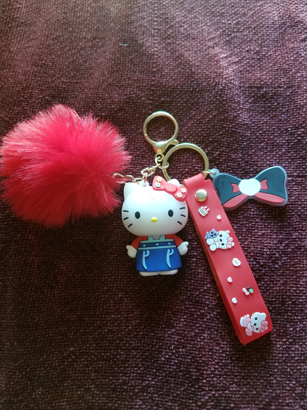 Hello Kitty Red Pom-Pom Keychain with Blue Outfit Charm